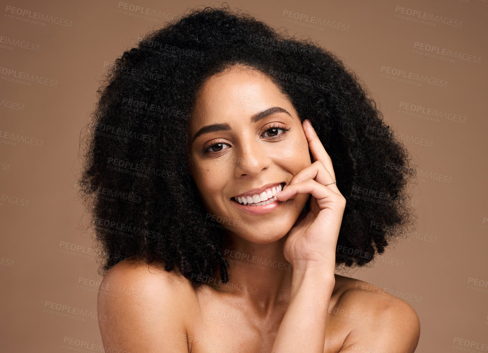 Buy stock photo Black woman, studio portrait and smile with beauty, makeup and cosmetic wellness with hands, face or natural hair. Model, soft skin and facial cosmetics, self care and afro by brown studio background