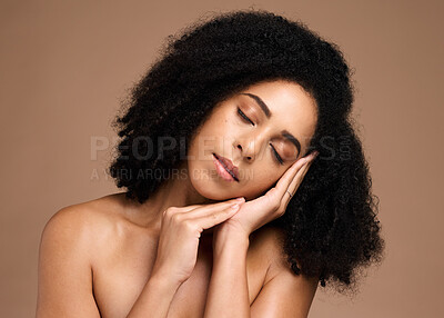 Buy stock photo Beauty, face and skincare with a model black woman in studio on a brown background for antiaging cosmetics. Facial, hair and wellness with an attractive young female posing on a wall for treatment
