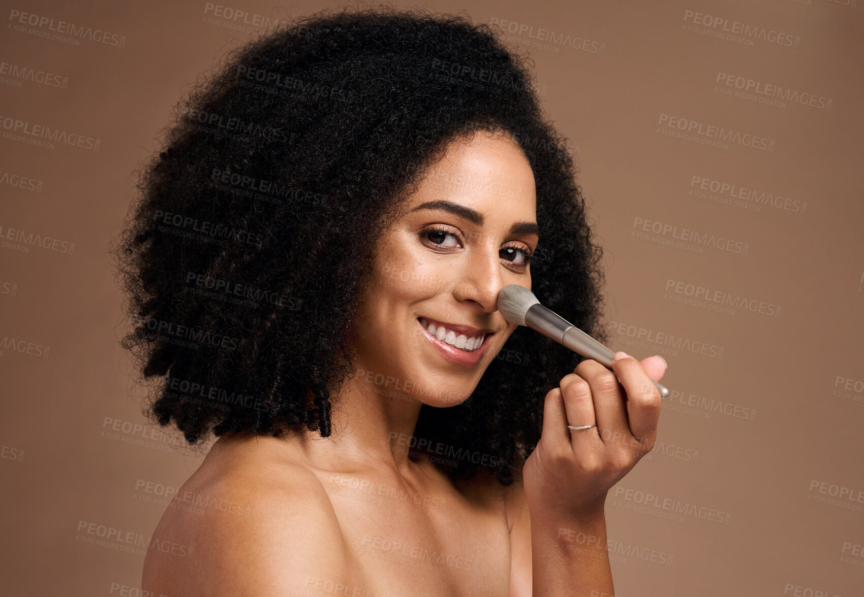 Buy stock photo Black woman, studio portrait and brush for foundation, beauty or cosmetic self care by backdrop with smile. Model, happy and powder makeup for face, skincare glow or application by studio background