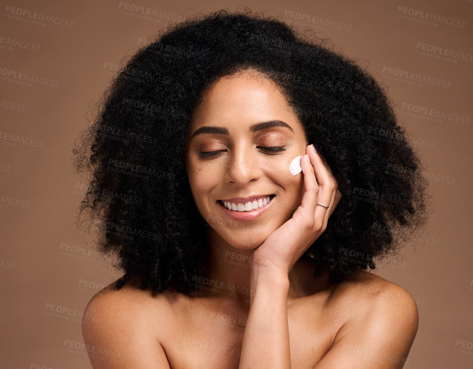 Buy stock photo Skincare, cream and black woman with smile for beauty, cosmetics and facial health promotion of product in studio. Happy African model with skin care, dermatology or sunscreen application on her face