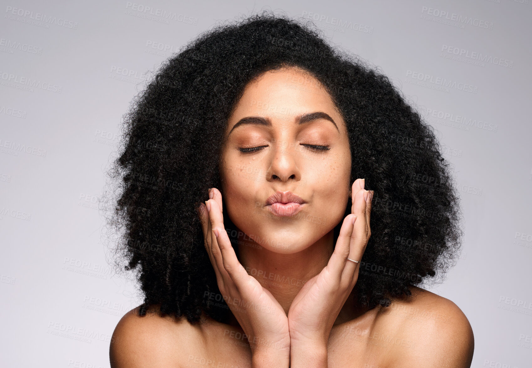 Buy stock photo Face kiss, skincare beauty and black woman with eyes closed in studio isolated on a gray background. Natural cosmetics, makeup and young female model pouting lips satisfied with spa facial treatment.