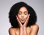 Face kiss, beauty skincare and black woman with eyes closed in studio isolated on a gray background. Makeup, natural cosmetics and young female model pouting lips satisfied with spa facial treatment.