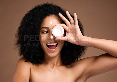 Buy stock photo Cream container, skincare and black woman in studio happy for facial product, natural cosmetics or beauty mockup. African model with wow face for serum, collagen or dermatology sunscreen in her hand