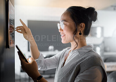 Buy stock photo Smart home wall system, phone and woman with digital monitor for house automation, air conditioning or safety security network. App software, ui dashboard panel and Asian girl programming IOT tech