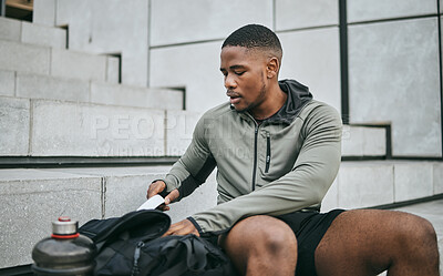 Buy stock photo Exercise, workout and black man on stairs, relax and training for fitness, wellness and health. African American male, athlete and looking in bag on steps, outdoor and sportswear for cardio or energy