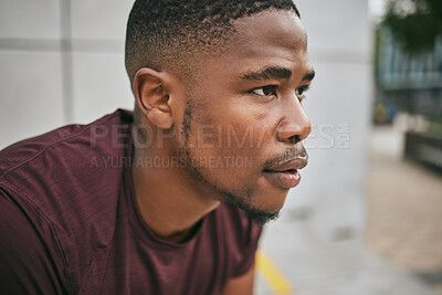 Buy stock photo Face, fitness and exercise with a black man runner breathing alone outdoor in the city for cardio or endurance. Vision, motivation and workout with a male athlete training in an urban town for health