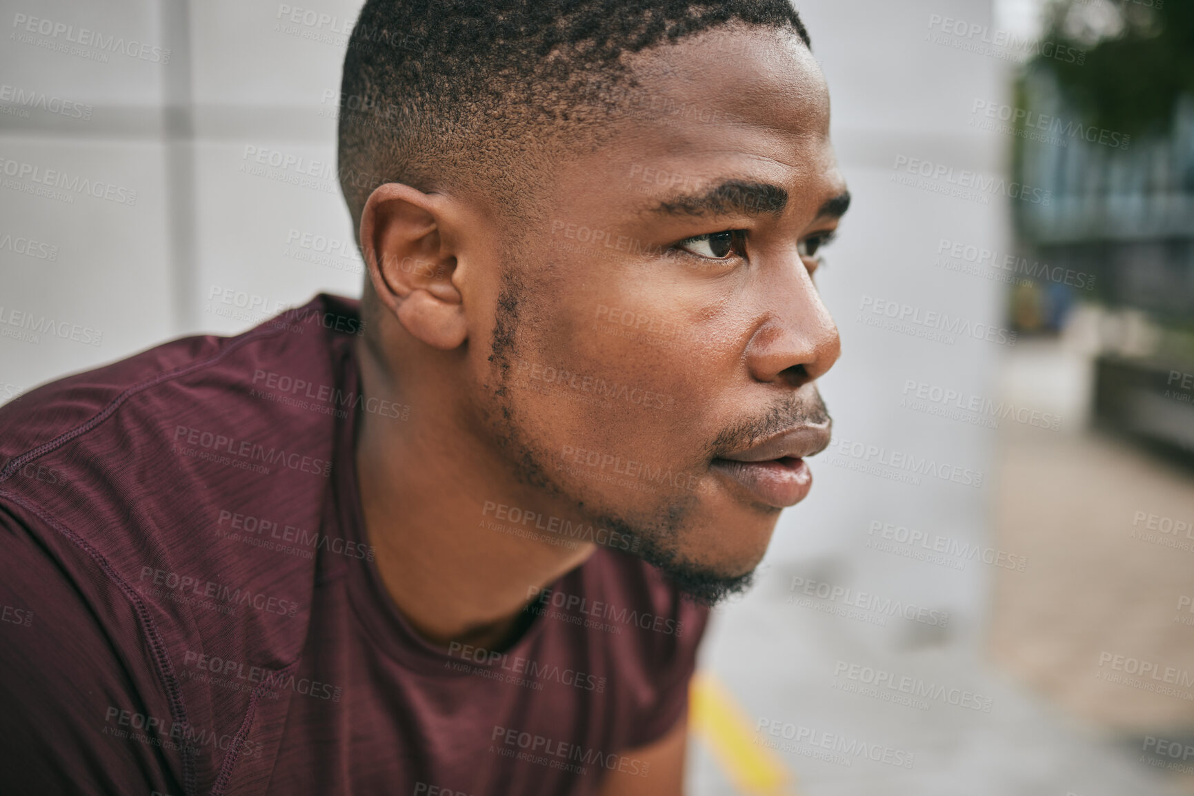 Buy stock photo Face, fitness and exercise with a black man runner breathing alone outdoor in the city for cardio or endurance. Vision, motivation and workout with a male athlete training in an urban town for health