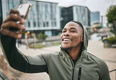 Buy stock photo Phone selfie, fitness and black man in city taking picture for social media or happy memory outdoors in winter. Sports, training and male runner with 5g mobile smartphone taking a photo on street.