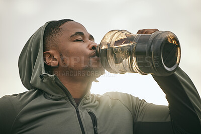 Buy stock photo Fitness, health or black man drinking water after training, exercise or workout for body hydration. Thirsty runner, bottle or tired sports athlete relaxing with goals or motivation resting in Chicago