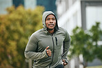 Fitness, runner or black man running in city for body training, exercise or workout with focus in Miami, Florida. City, mindset or healthy sports athlete with wellness goals, motivation or mission