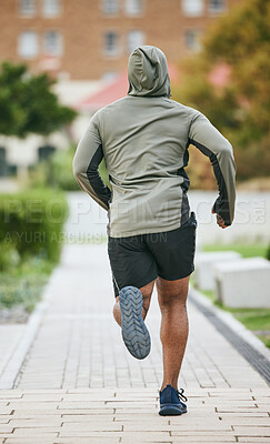 Buy stock photo Fitness, back and black man running in city in winter for health, wellness and strength. Sports, exercise and male runner training, cardio jog or exercising outdoors alone on street for marathon.