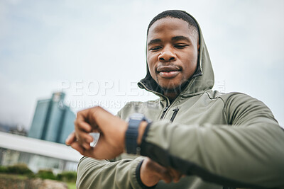 Buy stock photo Time, watch and black man running in city for fitness motivation, training goal and heart performance in Nigeria. Monitor, exercise and African runner with a smart watch for reading health progress