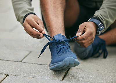 Buy stock photo Fitness, hands and black man tie shoes in city and getting ready for running, workout or exercise. Wellness, sports and male runner tying sneaker lace and preparing for training on street outdoors.
