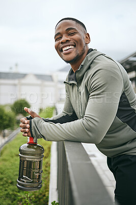 Buy stock photo Fitness, happy or black man with smile or pride after body training, exercise or workout with a water bottle in Miami. Portrait, relaxing or healthy sports athlete with wellness goals or motivation 