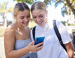 Smartphone, park and student friends on internet, social media post or website information search for university, campus or college. Youth women reading mobile newsletter for education mental health