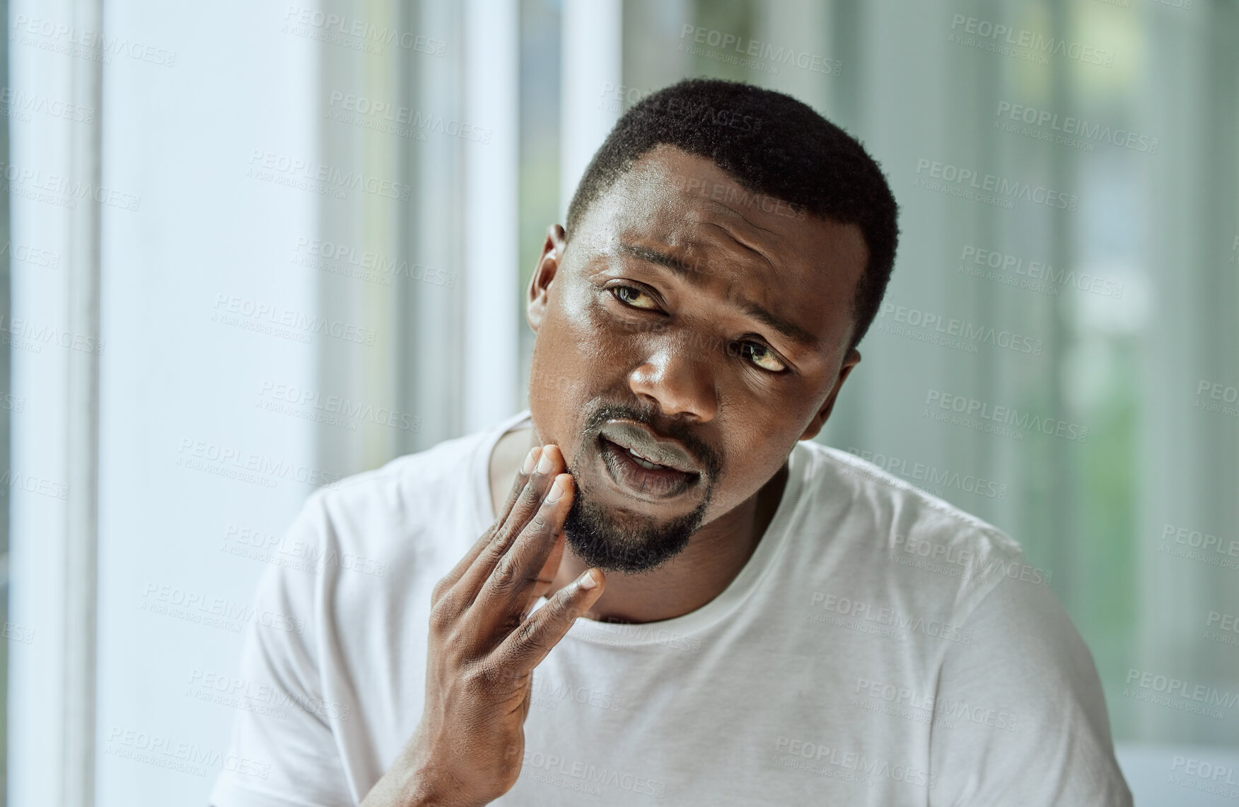 Buy stock photo Sad, aesthetic and anxiety of black man with acne confused with face analysis in home bathroom mirror. Unhappy skincare man checking pimple problem in reflection with morning grooming routine.

