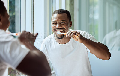 Buy stock photo Morning, happy and black man brushing teeth in bathroom for health, hygiene and clean smile. Self care, cleaning and oral hygiene for healthy teeth of person smiling with confidence in home.

