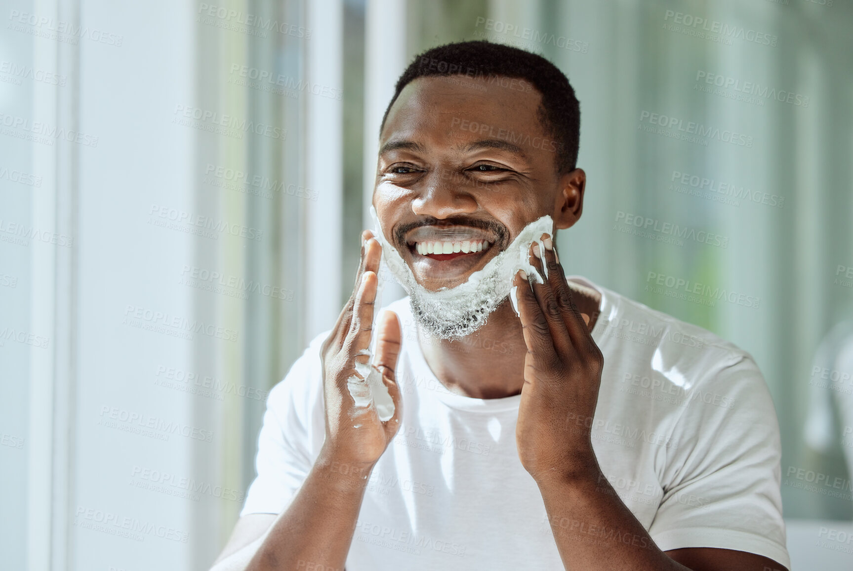 Buy stock photo Shaving, cream and black man grooming face for clean look, hygiene care and beauty morning routine in the bathroom. Skincare, happy and African person ready to shave beard and facial hair with foam