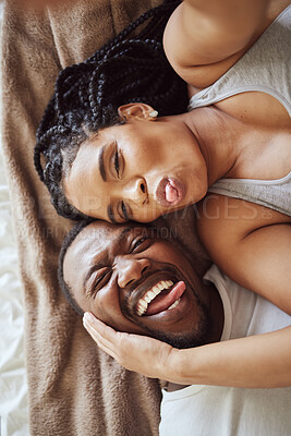 Buy stock photo Black couple, love and bedroom selfie while happy and funny together with tongue out on bed at home, apartment or hotel. Portrait of a young man and woman in a happy marriage with commitment and care