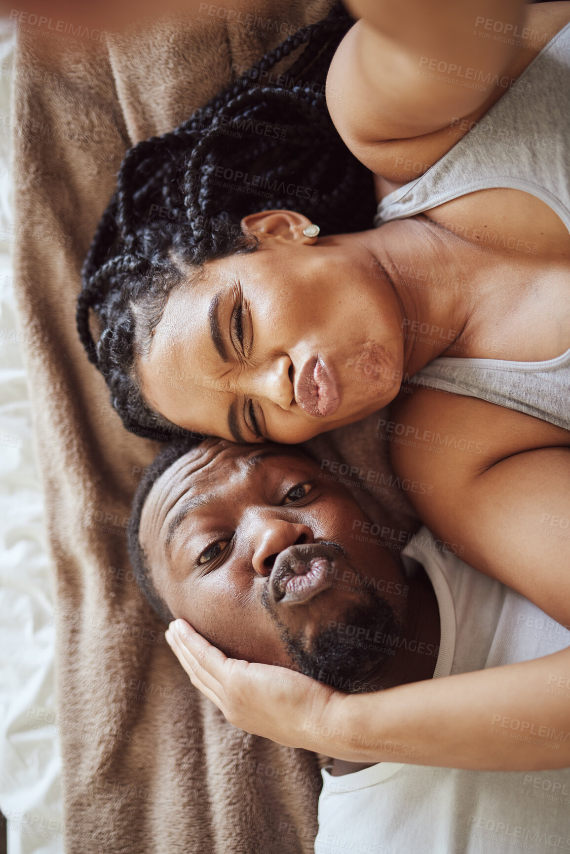 Buy stock photo Black couple, love and bedroom selfie while happy and funny together, pouting on bed at home, apartment or hotel. Portrait of a young man and woman in a happy marriage with commitment in top view