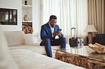 African businessman in hotel room, reading email on smartphone and corporate professional in Chicago. Black entrepreneur typing message, luxury accommodation in city and hospitality for travel