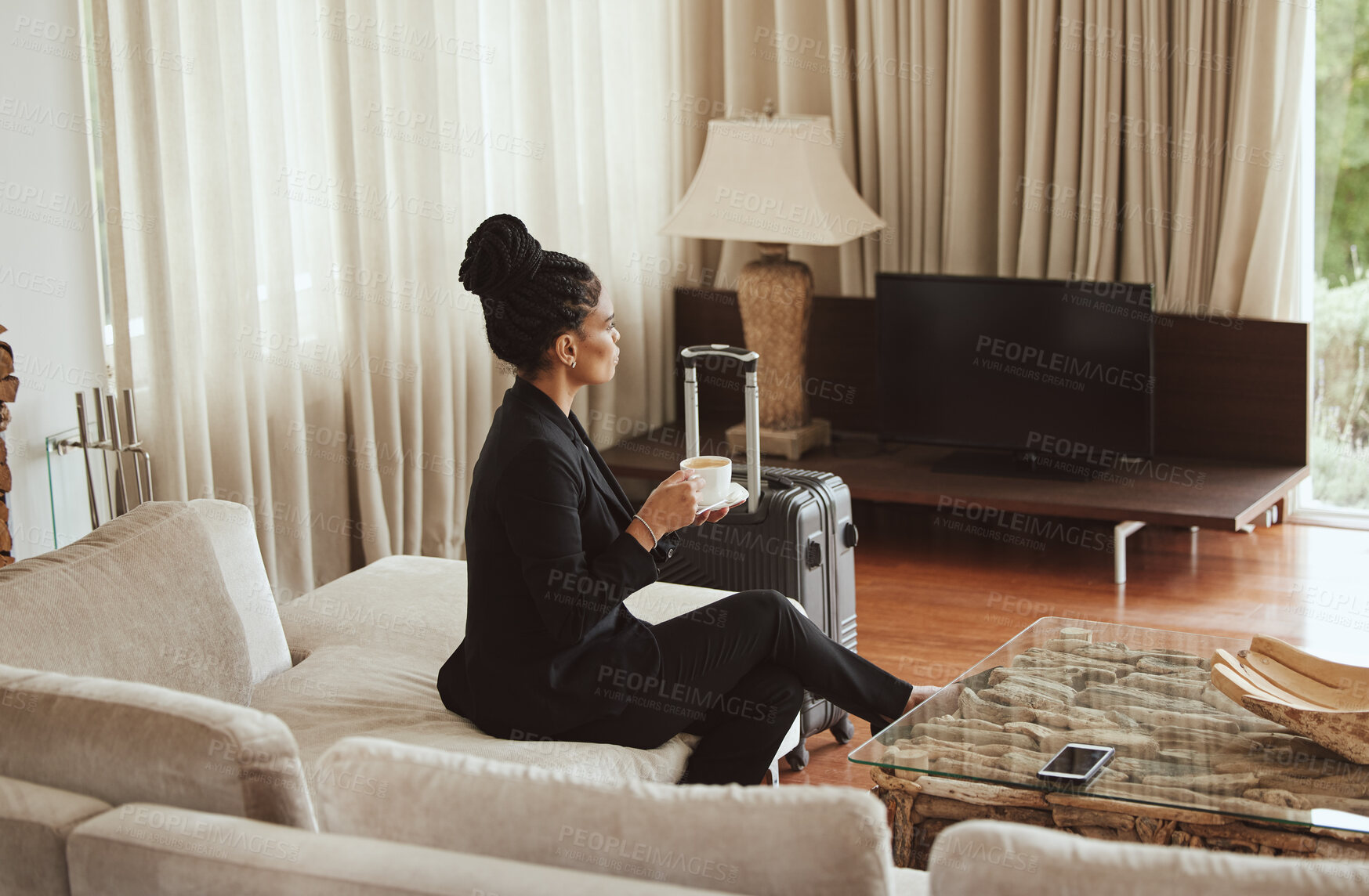 Buy stock photo Travel, coffee and business woman in a bedroom relaxing, thinking and drinking a cup of caffeine. Career, luggage and professional corporate female sitting in hotel enjoying a warm drink on work trip