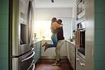 Black couple, happy home and love while together with care and happiness in a marriage with commitment and care. Young man and woman hug while in the kitchen to celebrate  their house or apartment