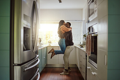 Buy stock photo Black couple, happy home and love while together with care and happiness in a marriage with commitment and care. Young man and woman hug while in the kitchen to celebrate  their house or apartment