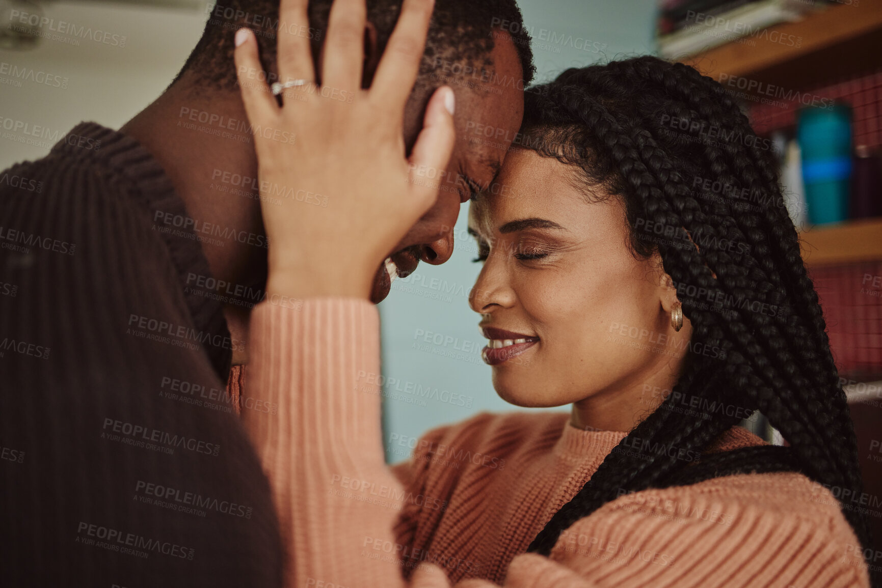 Buy stock photo Black couple, love and care while together for happiness in a happy marriage with commitment and care. Young man and woman touching face of head while in a house to bond, intimate and show commitment