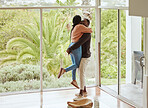 Black couple, hug and love while happy together in their new house with love and happiness to celebrate anniversary or home. Young man and woman with support, care and joy in a healthy marriage