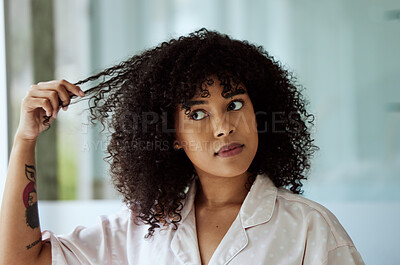 Buy stock photo Morning, natural and black woman with hair care bathroom routine feeling curly hair texture. Beauty, self care and african girl thinking of cosmetic treatment in home with thoughtful face.
