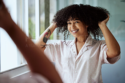 Buy stock photo Beauty, hair and mirror with a black woman in the bathroom of her home for a morning haircare routine. Growth, wellness and keratin with an attractive young female styling her afro in the house