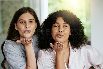 Buy stock photo Women portrait, friends and blowing kisses in home, house or hotel bathroom for bonding holiday, skincare or grooming. Smile, happy and people face with blow gesture in relax spa or luxury treatment
