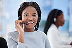 Black woman, portrait and call center headset in telemarketing office, contact us company or b2b sales business. Smile, happy face and customer support consultant in CRM coworking space on help deal