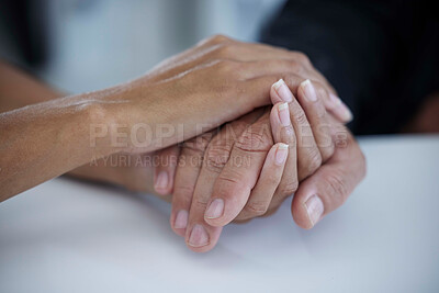 Buy stock photo Hands, support and trust with a business woman consoling or comforting a man employee in the office at work. Help, love and hope with a female and male employee holding hands in comfort or support