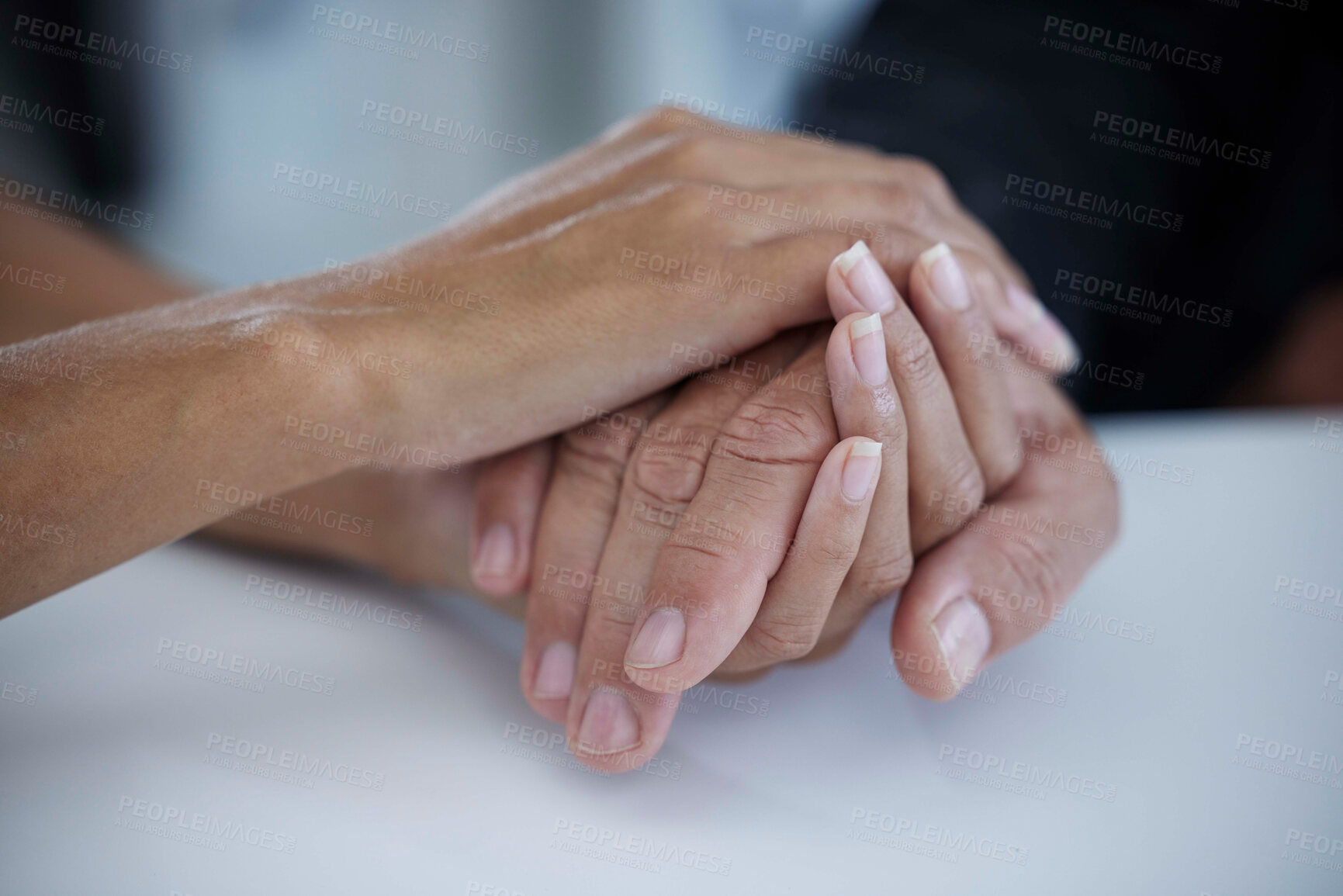 Buy stock photo Hands, support and trust with a business woman consoling or comforting a man employee in the office at work. Help, love and hope with a female and male employee holding hands in comfort or support