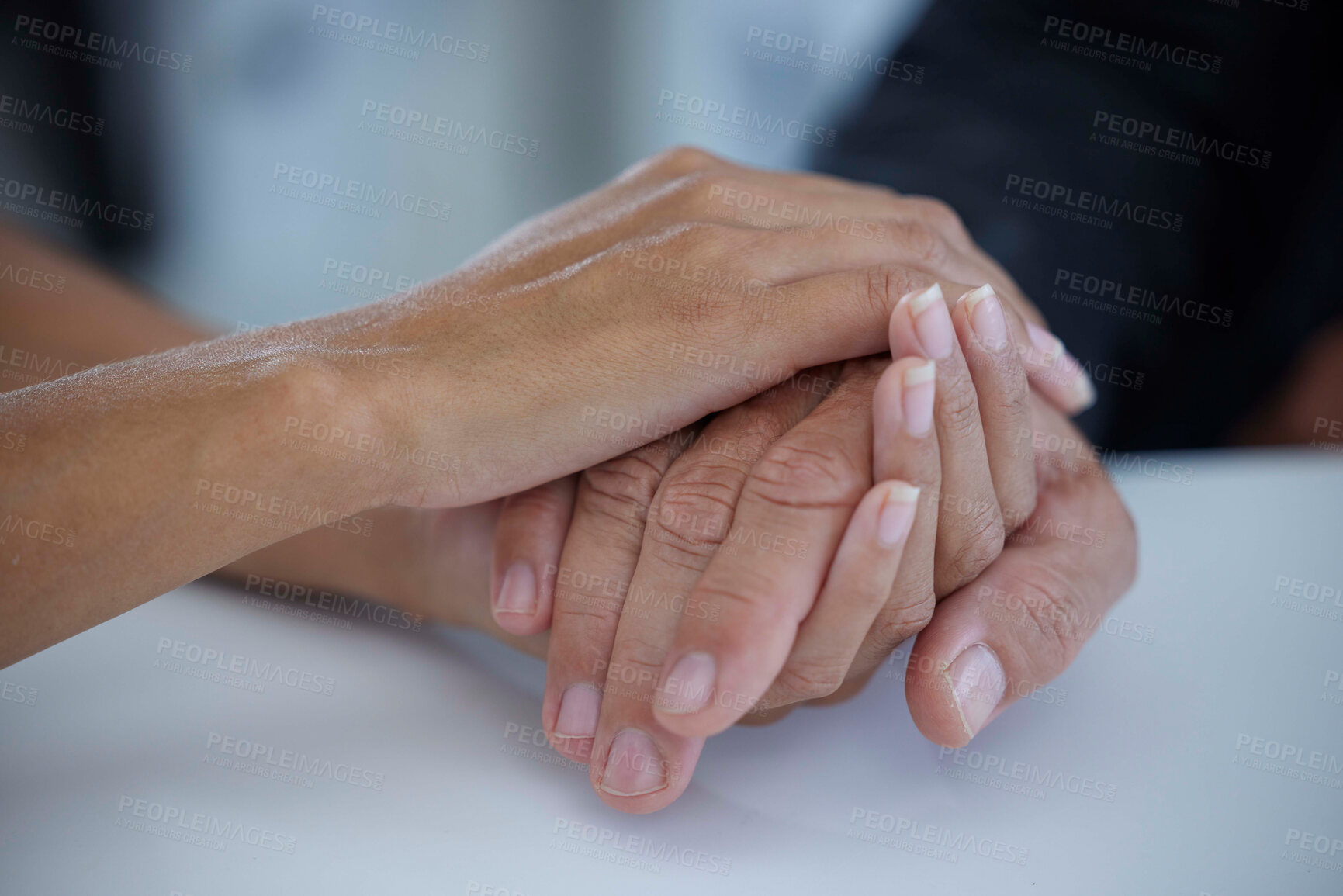 Buy stock photo Hands, care and love with a business woman consoling or comforting a man employee in the office at work. Help, console and hope with a female and male employee holding hands in comfort or support