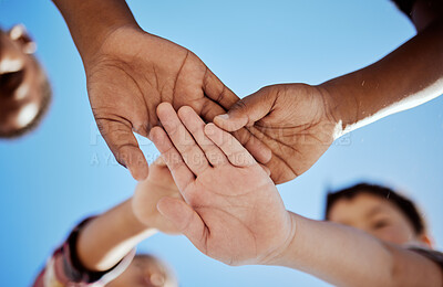 Buy stock photo Diversity, stack of hands and children in unity, support or solidarity with a blue sky background. Solidarity, collaboration and multiracial kid friends cheering together for motivation, fun and joy.