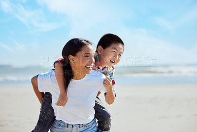 Buy stock photo Mom, beach piggyback and asian kid with interracial family bonding, nature and outdoor vacation in sunshine. Happy family, ride and black woman for adoption, love and adventure by ocean on holiday
