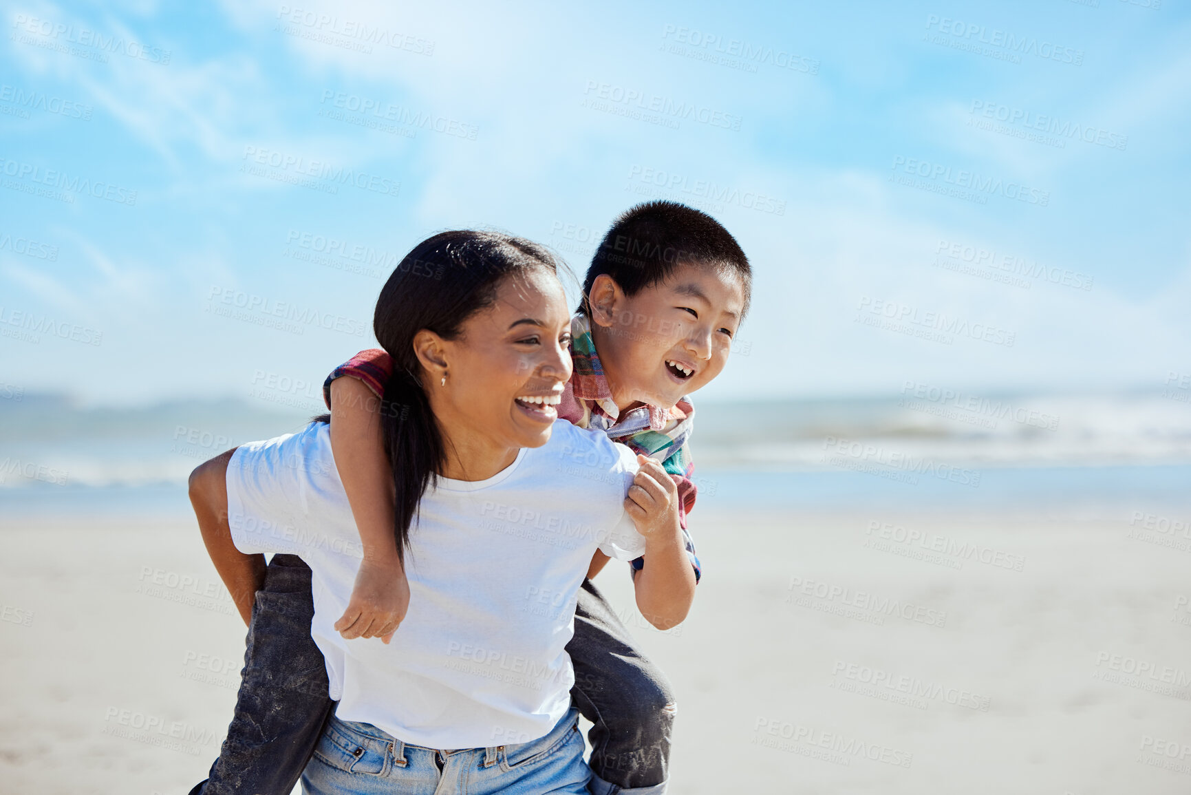 Buy stock photo Mom, beach piggyback and asian kid with interracial family bonding, nature and outdoor vacation in sunshine. Happy family, ride and black woman for adoption, love and adventure by ocean on holiday