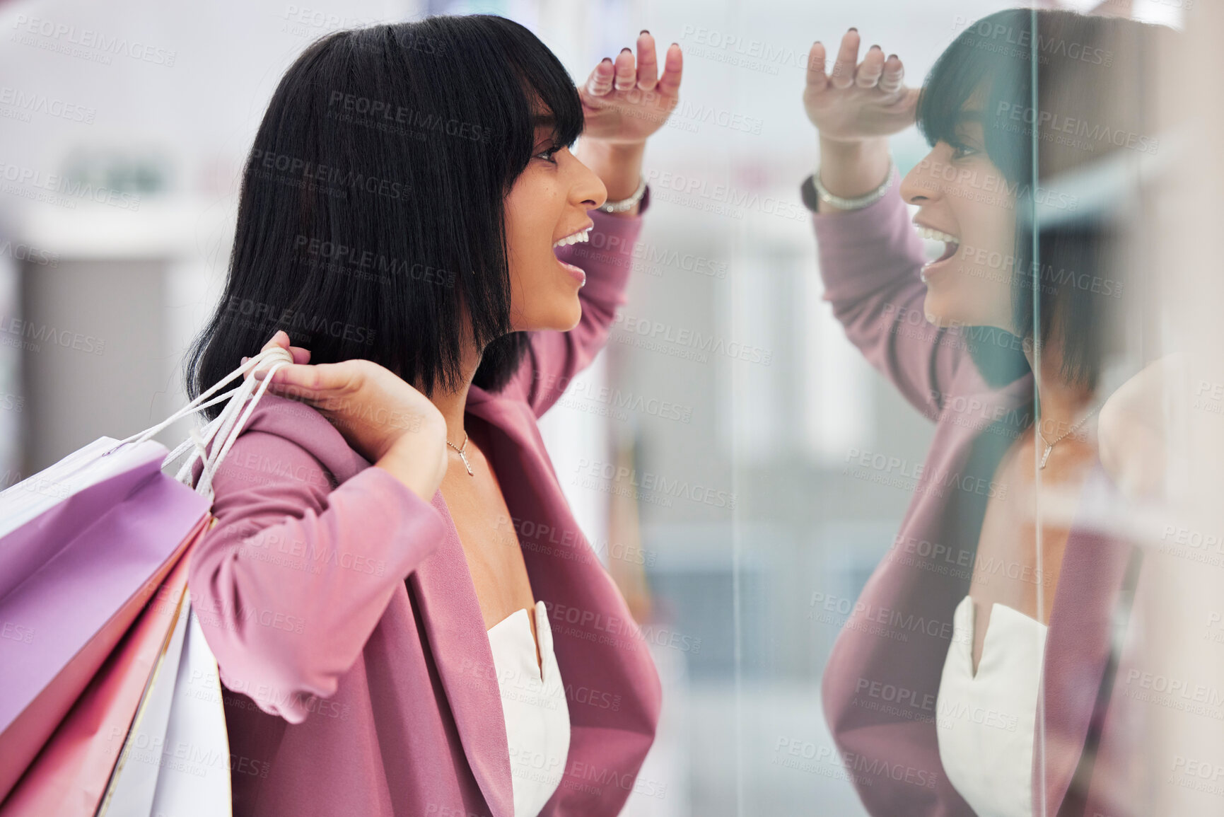 Buy stock photo Excited woman, window shopping and mall for retail therapy, sale or customer discount at a store. Paper bag, fashion and female happy about clothes, promotion or commerce product during travel