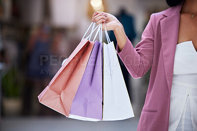 Buy stock photo Shopping bag, customer and hands of a women holding paper bag in a mall for retail, therapy, sale and discount. Fashion female holding purchase of clothes or gift on discount or promotion at a store