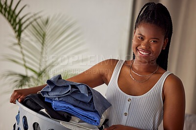 Buy stock photo Laundry, basket and portrait of black woman with clothes folded, housekeeping and smile in living room. Happiness, cleaning and washing, happy modern housewife doing household chores in Atlanta home.