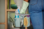 Cleaning products, bucket and woman maid in a home for spring cleaning, disinfection or chores. House, maintenance and closeup of female cleaner or housewife with bacteria, germs or dust to clean.
