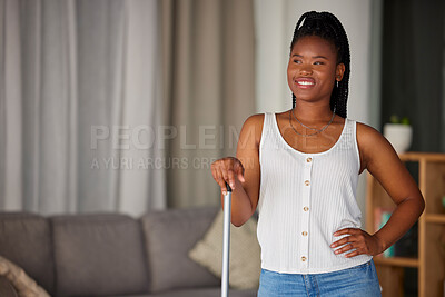Buy stock photo Black woman, broom and cleaning with a smile and mockup in a home living room. Clean house, happy person and relax cleaner proud of housekeeping work feeling calm with happiness by a lounge sofa