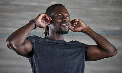 Buy stock photo Exercise, black man and earbuds for music, wellness and motivation for fitness, cardio or muscle power. African American male, athlete or earphones for podcast, radio or workout to relax or streaming