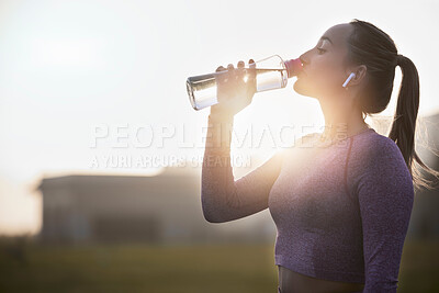 Buy stock photo Fitness, sunset and woman drinking water bottle after training workout, exercise and outdoor cardio running. Thirsty young athlete, sports hydration and nutrition for wellness, healthy body or energy