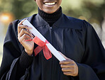 University graduation, diploma and hands of black woman with award for studying achievement. Closeup graduate student with paper certificate of success, celebration and education goals of learning