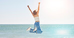Happy woman, freedom and jump at beach with arms stretching for purpose, energy and motivation. Back view, success and fun at sea, summer vacation and sunshine travel, hope and wellness celebration 