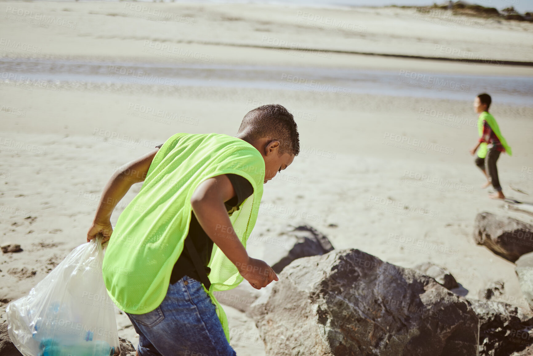 Buy stock photo Environment, cleaning and children with plastic on beach for clean up, pollution and eco friendly volunteer. Sustainability, recycle and boy reduce waste, trash and global warming on beach sand
